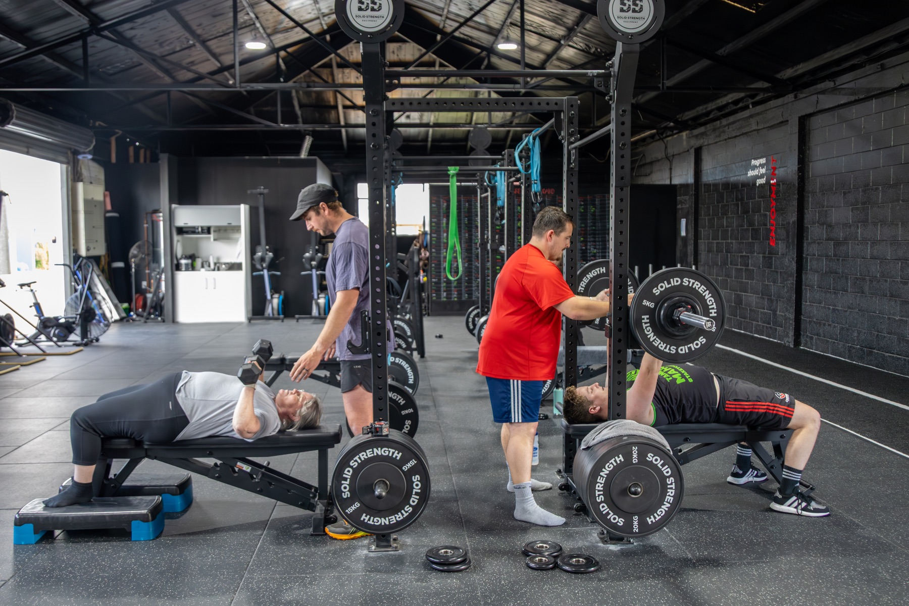 Coach guiding a strength session at Pinnacle Performance