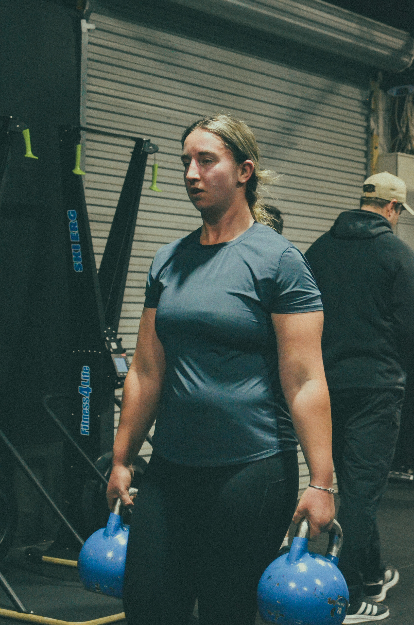 Pinnacle member carrying kettlebells